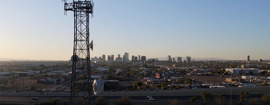 View of a cell tower over looking an Arizona town